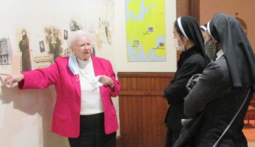 Sister of Charity, Sr. Mary Canavan, vice postulator for the cause of Blessed Miriam Teresa sainthood explains to the sister-students the panoramic depiction of Blessed Miriam Teresa’s life